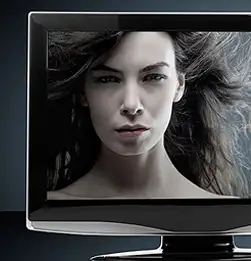 cropped image of a computer monitor with balck and white image of a woman on screen