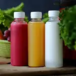 brighly colored fruit juices in clear bottl;es using Milliken's Polymer Additives