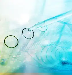 pale image of a dropper with test tubes