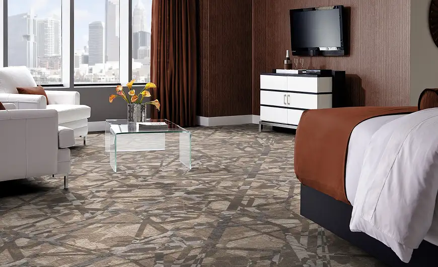 Guestroom with geometric light brown carpet