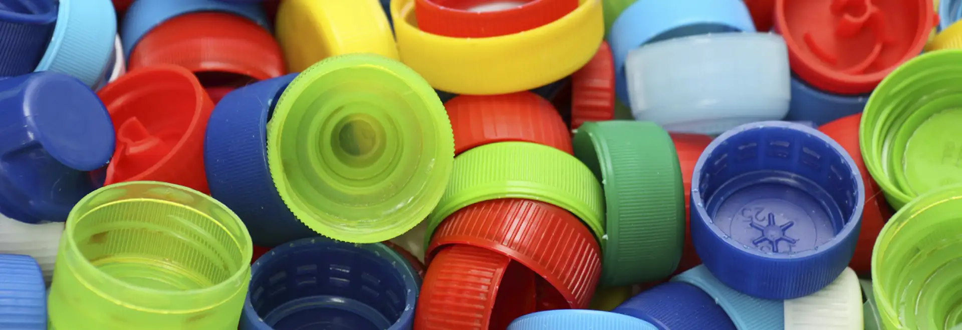 close shot of colorful plastic bottle caps