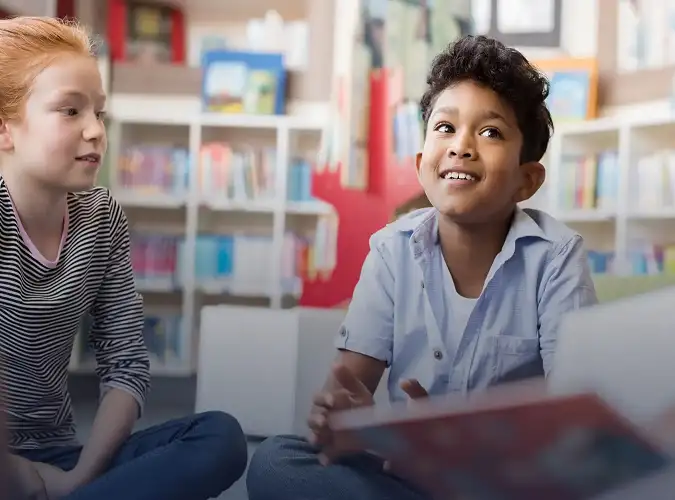 smiling children being read a story