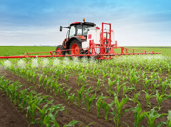 red tractor with healthy crops