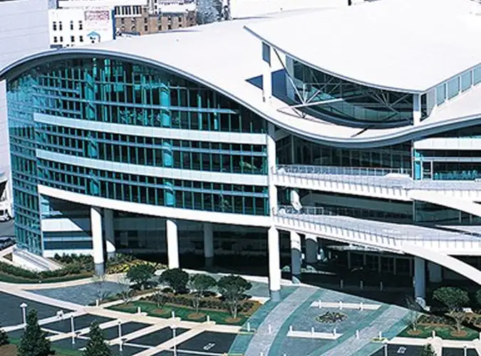 Exterior or a modern white commerical building with many windows