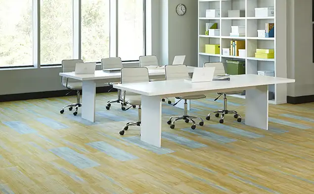 eductaional workspace with yelow and teal plank carpet tiles