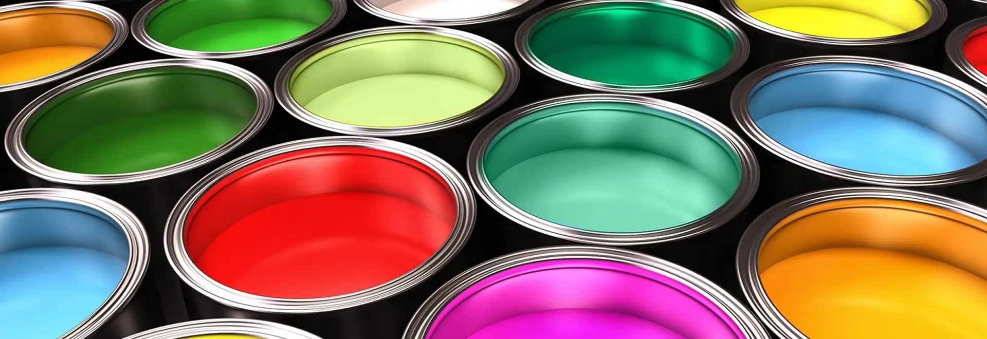 close shot of opend paint cans with colorful paint