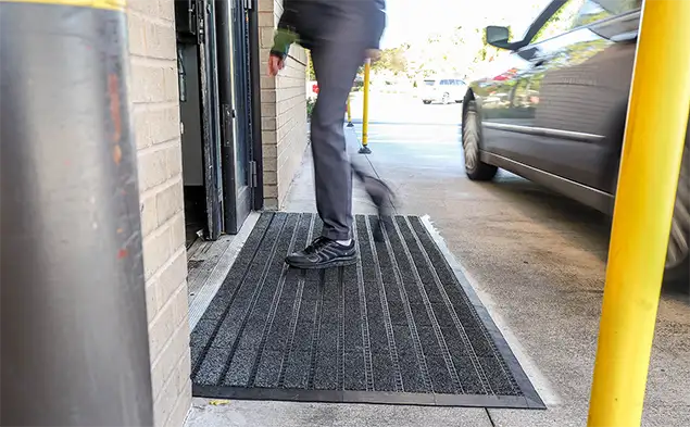 building exterior entrance with person walking on OBEX Grid