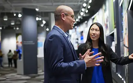 Manufacturing manager coaching an employee during a one-on-one development conversation