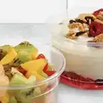 Clear food and beverage packaging with fruit representing nuecleating agents