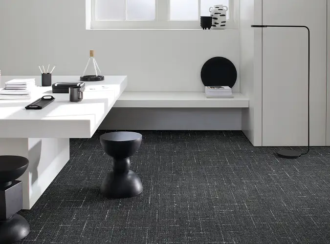 Black and white modern office with dark carpet tile