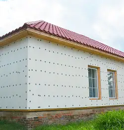 Exterior of a house under construction showing Fiberboards and Insulation