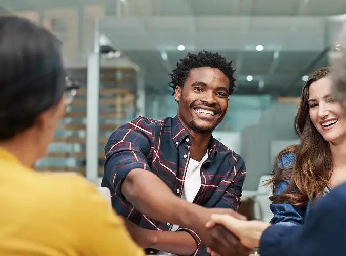 miling people shaking hands