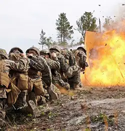 troups in combat situation wearing Milliken millitary defense uniforms