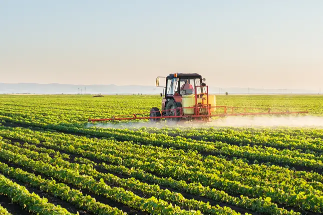 large farm harvester on field