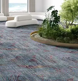 modern interior with white rounded seating, an island of plants with a textural carpet installation