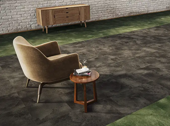 Chair and side table on carpet tile with green accent boarder for the Watercolor collection