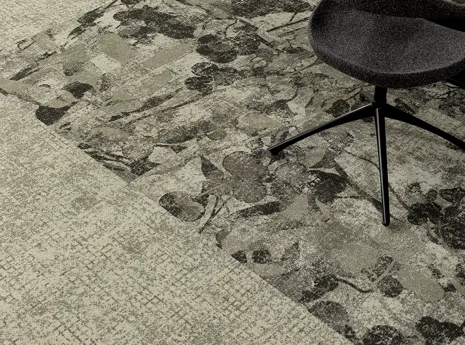close up of textural and organic carpet tiles in neutral color