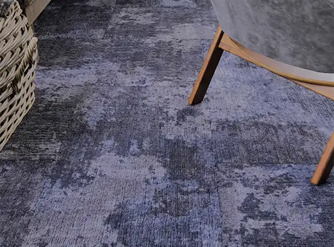 close up of blue textured carpet tile flooring