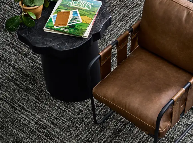 Leather chair and table on Ignited Earth carpet tile flooring