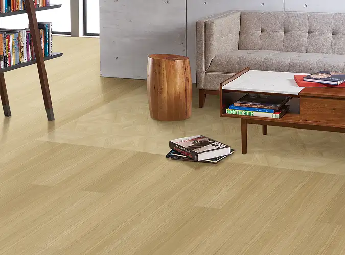 Seating area with sofa and end tables on Milliken LVT flooring