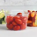 clear food containers with cherry tomatoes and fruit