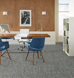 Modern desk area with a natural feel on grey Milliken flooring
