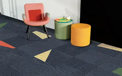 Brightly colored chairs with flooring that has colorful geometic inserts