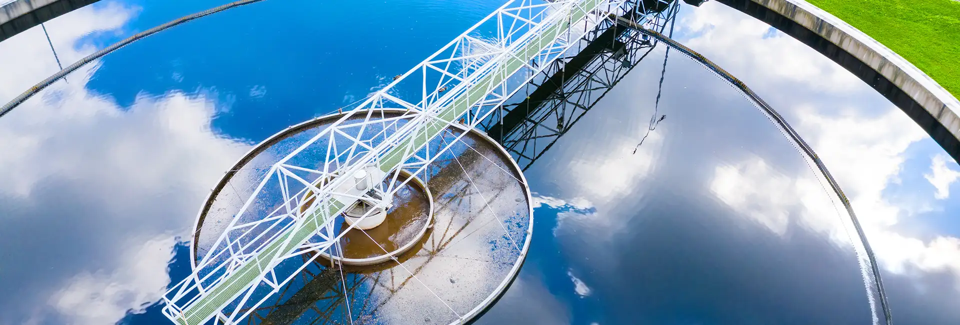 refelection of clouds on a wter treatment tank