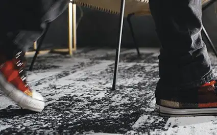 person walking on carpet tile flooring