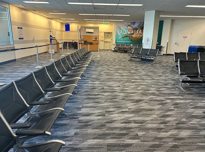 Gray patterned carpet tile flooring in an airport gate area