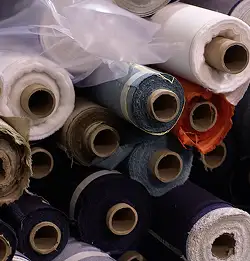rolls of textiles stacked