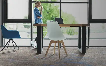 person standing on milliken cushion backed carpet tile