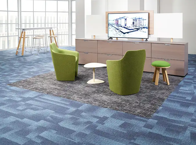 green chairs on field of blue carpet tile with a gray inset from the Nordic Stories collection