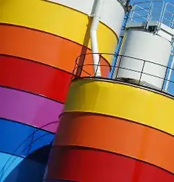 rainbow painted industrial tanks