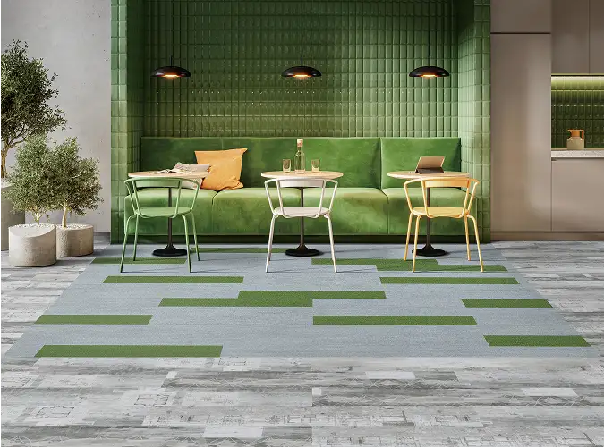 Public seat with bright green banket on LVT flooring with green accents