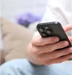 tight shot of a person using a cell phone