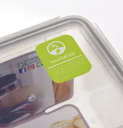 close up of a clear food container lid with UL label 