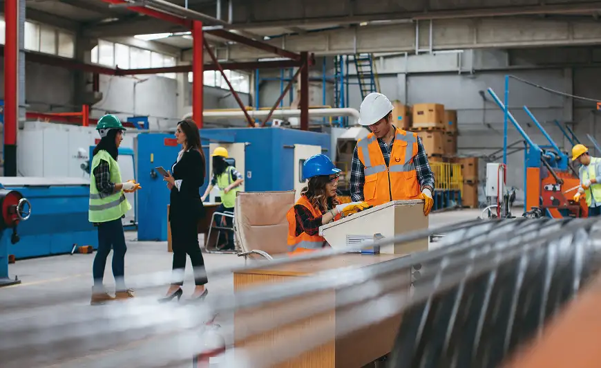groups of associates collaborating on manufacturing plant floor