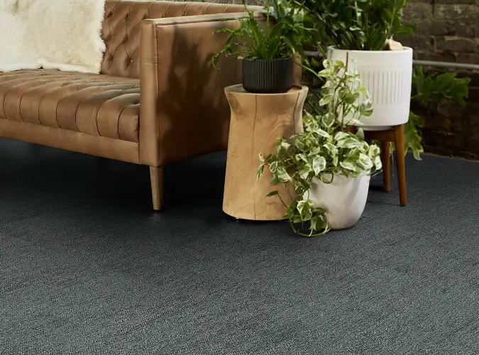 close up of a sofa on gray carpet tile from the Major Frequency One collection