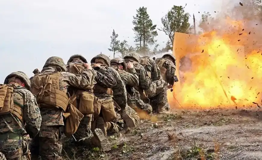 troups in combat wearing Milliken Millitary Combat Uniforms